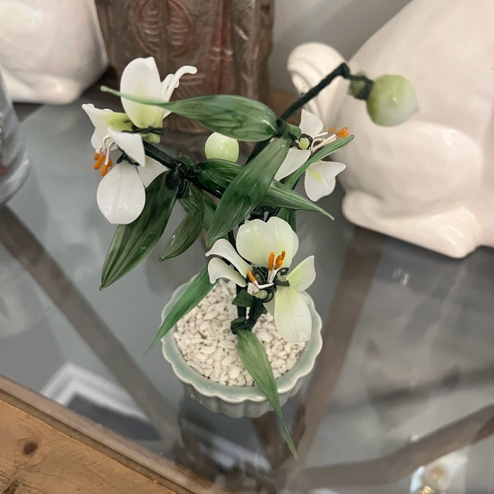 Vintage jade quartz tree in celadon pot. White and Green Plant.